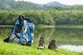 Couple Brown men`s hiking mid ankle shoes and backpack.