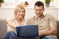 Couple browsing internet on laptop