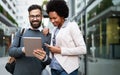 Couple, business, technology concept. Businessman with tablet and woman with smartphone talking