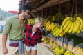 Couple Buying Bananas On Street Traditional Market, Young Man And Woman Travelers Royalty Free Stock Photo