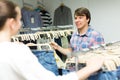 Couple buying blue jeans at store Royalty Free Stock Photo