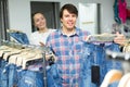 Couple buying blue jeans at store Royalty Free Stock Photo