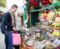 Couple buying Christmas flower at market Royalty Free Stock Photo