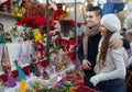 Couple buying Christmas flower at market Royalty Free Stock Photo