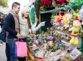 Couple buying Christmas flower at market Royalty Free Stock Photo