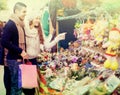 Couple buying Christmas flower at market Royalty Free Stock Photo