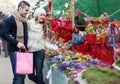 Couple buying Christmas flower at market Royalty Free Stock Photo