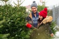 Couple buying Christmas tree Royalty Free Stock Photo