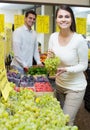 Couple buying fresh seasonal fruits in market Royalty Free Stock Photo