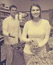 Couple buying fresh seasonal fruits in market Royalty Free Stock Photo