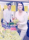 Couple buying fresh seasonal fruits in market Royalty Free Stock Photo