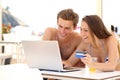 Couple buying online on holidays Royalty Free Stock Photo