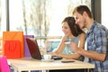 Couple buying online with shopping bags