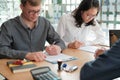 Couple buying renting house car signing mortgage insurance purchase order contract agreement with realtor real estate agent Royalty Free Stock Photo