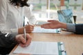 Couple buying renting house car signing mortgage insurance purchase order contract agreement with realtor real estate agent Royalty Free Stock Photo