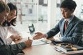 Couple buying renting house car signing mortgage insurance purchase order contract agreement with realtor real estate agent Royalty Free Stock Photo