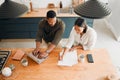 Couple calculating budget, finance and tax while planning investment, loan and bills at home from above. Managing Royalty Free Stock Photo