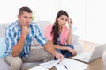 Couple calculating home finances together in house Royalty Free Stock Photo