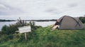 Couple camping with a tent at the seaside in Bergen, Norway