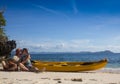 Couple canoeing in lagoon of West French indies