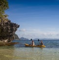 Couple canoeing in lagoon of West French indies