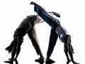 Couple capoeira dancers dancing silhouette