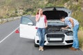 Couple after a car breakdown Royalty Free Stock Photo