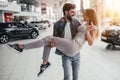 Couple at car dealership Royalty Free Stock Photo