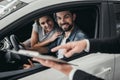 Couple at car dealership Royalty Free Stock Photo