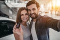 Couple at car dealership Royalty Free Stock Photo