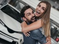 Couple at car dealership