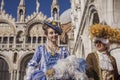 Couple of carnival masks in san Marco Place