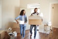 Couple Carrying Boxes Into New Home On Moving Day Royalty Free Stock Photo