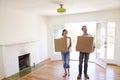 Couple Carrying Boxes Into New Home On Moving Day Royalty Free Stock Photo