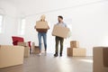 Couple Carrying Boxes Into New Home On Moving Day Royalty Free Stock Photo