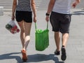 A couple carrying shopping bags