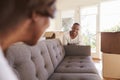 Couple Carrying Sofa Into New Home On Moving Day Royalty Free Stock Photo