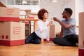 Couple Celebrating Moving Into New Home Drinking Champagne Royalty Free Stock Photo