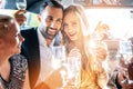 Couple celebrating party in limousine with friends Royalty Free Stock Photo