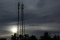 Couple Cell SiteTower in Communacation the Golden Hour gray Sunset on a land Field