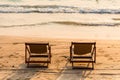 A couple of chairs on sunset beach Royalty Free Stock Photo