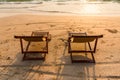 A couple of chairs on sunset beach Royalty Free Stock Photo