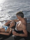 Couple With Champagne Flute Relaxing On Yacht Royalty Free Stock Photo