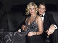 Couple With Champagne Flutes In Limo Royalty Free Stock Photo
