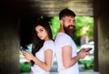 Couple chatting smartphones. Communication problems. Virtual relationship. Girl attractive brunette bearded hipster man Royalty Free Stock Photo