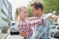 Couple in check shirts and denim hugging each other Royalty Free Stock Photo