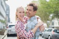 Couple in check shirts and denim hugging each other Royalty Free Stock Photo