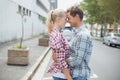 Couple in check shirts and denim hugging each other Royalty Free Stock Photo