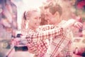 Couple in check shirts and denim hugging each other Royalty Free Stock Photo