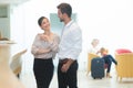 Couple checking in at hotel reception smiling happy Royalty Free Stock Photo